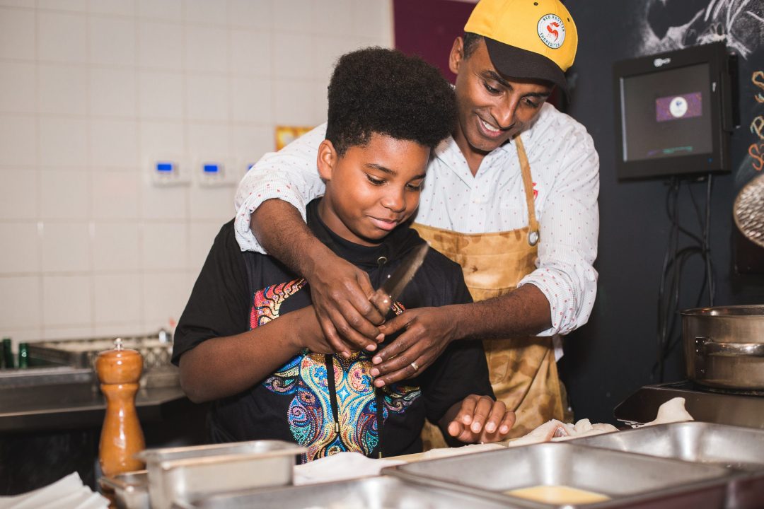 A HEAF student and his mentor working in a kitchen