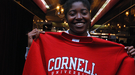 A HEAF student holds her Cornell University sweatshirt
