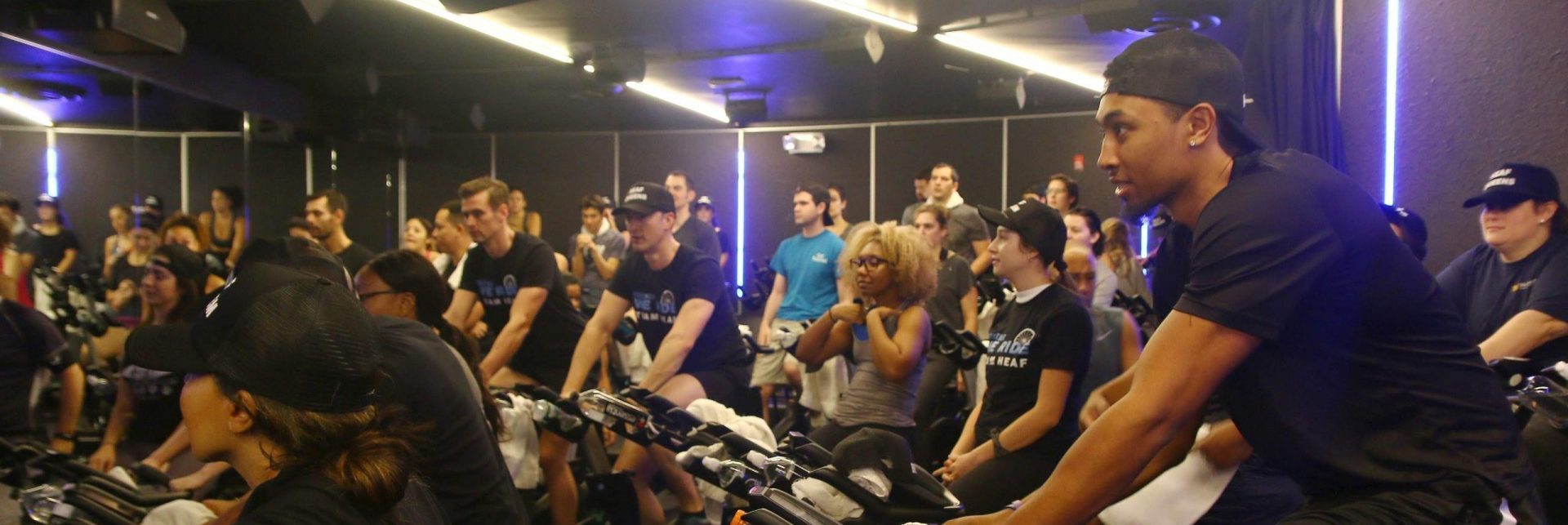Donors take a spinning class together to raise money for HEAF.